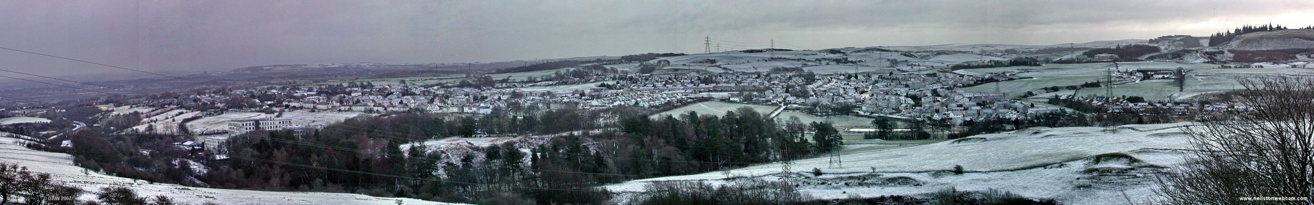 Winter panoramic view over Neilston
Taken in February 2005 after a light dusting of snow.  The Neilston Pad is on the right and the Mill on the left.  Some of the other photos in this gallery might lead you to think we get a lot of snow but in recent years this is more typical of what snow we get and it doesn't usually last long.  [url=http://www.streetmap.co.uk/streetmap.dll?G2M?X=246235&Y=657350&A=Y&Z=3/]Map location[/url]
