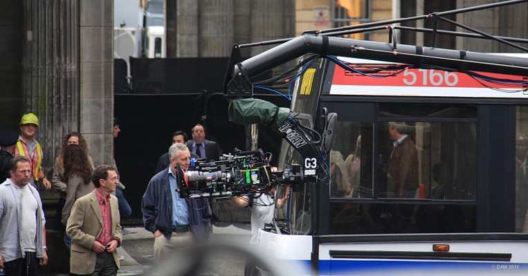 35mm Digital Movie Camera, World War Z, Glasgow
Gone are the days when you use film to make a movie.  This 35mm digital camrea is on the arm of the Pursuit camera car.  I suspect its an [url=http://www.arridigital.com//] Arri [/url] Alexa Camera, but don't quote me. Extras wait patiently in the background for something to happen.
