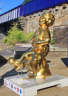 All Gold, Oor Wullie Big Bucket trail, Barrhead
Scotland's first ever national public art trail ran from July until the end of August in 2019 and is designed to raise awareness and funds for Scotland's childrens hospital charities.  It featured lots of painted "oor Wullie" statues in 5 cities around Scotland.... and even Barrhead.  This one is situated outside Barrhead Railway station.
