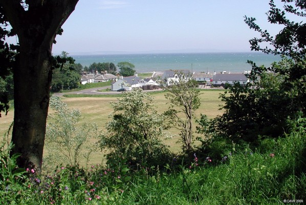 Ardwell estate village
Over looking the houses of Ardwell from Ardwell House Gardens.    The Machars can be seen in the distance over Luce Bay.  [url=http://www.streetmap.co.uk/map.srf?X=210900&Y=545710&A=Y&Z=120/] Map location. [/url]
