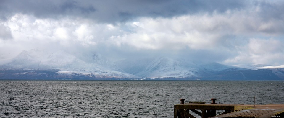Arran from Portencross
The Isle of Arran with its snow covered mountains obscured by cloud on a cold winter day.  [url=http://www.streetmap.co.uk/map.srf?X=217575&Y=649135&A=Y&Z=120/] Map location. [/url]
