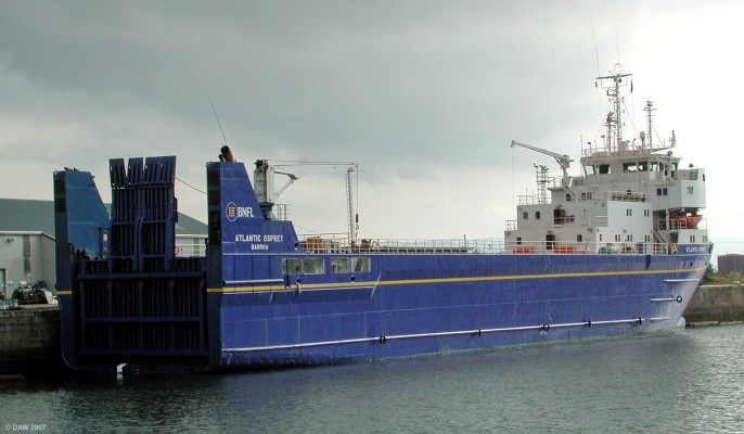 Atlantic Osprey, Port Glasgow, 2002
A controversial ship converted from a German RO/RO ferry in 2001 for BNFL to transport Nuclear Fuel.  On the same year this photo was taken it had suffered a serious engine room fire which its crew were unable to supress without external assistance.  More recently it has been used to return damaged armoured vehicles from Iraq.  The ship is currently owned by the [url=http://www.nda.gov.uk/]NDA. [/url]

