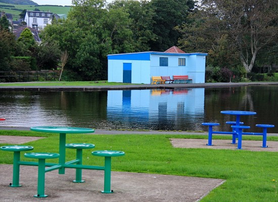 Reflections, Aubery boating pond, Largs
When I was a boy there were childrens paddle boats on the pond which were kept in the shed.  Today it is used by a local model boating club. [url=http://www.streetmap.co.uk/map.srf?X=219921&Y=660396&A=Y&Z=115/] Map location. [/url]
