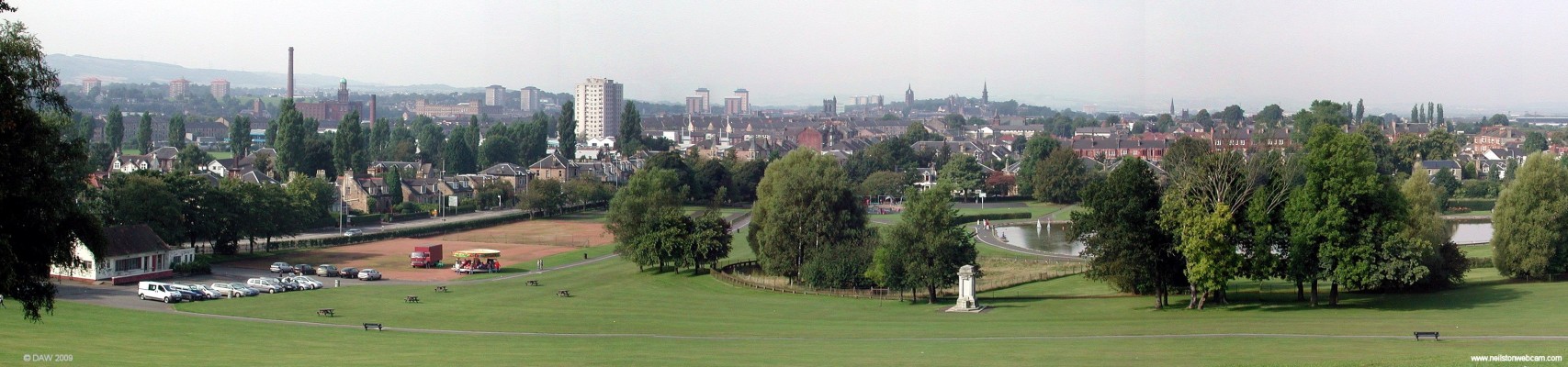Over looking Paisley from the top of Barshaw Park
Taken on a hazy late summer day.  From here you can see most of the landmarks of Paisley, the Chimmney on the left is that of the old Mile End Mill.  The three spires above the War Memorial in the park are, from the left, Paisley Abbey, Coats Memorial and the High Church.  [url=http://www.streetmap.co.uk/map.srf?X=250223&Y=664255&A=Y&Z=115/] Map location. [/url]
