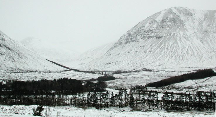 Beinn a Chaisteil, winter
Looking from the A82 over towards Beinn a Chaisteil rising to some 883m.  The bridge carries the main west coast railway line north.  [url=http://www.streetmap.co.uk/map.srf?X=232786&Y=735877&A=Y&Z=120&ax=231871&ay=735082/] Map location. [/url]
