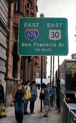 Road sign, World War Z, Glasgow
Don't follow this sign, its much further than half a mile.  The Benjamin Frankilin Bridge is Philadelphia's equivalent to the Kingston Bridge, but longer.
