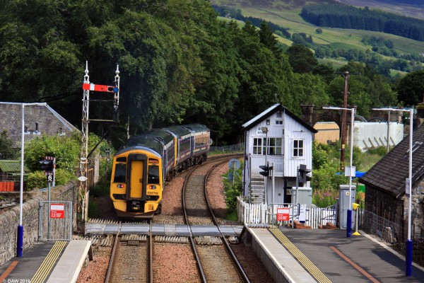 Blair Atholl Railway Station
Please turn your watches back 60 years you are approaching Blair Atholl.  Almost like a scene from the 1950's with the signal box and the semaphore signal if it wasn't for the modern train.  The station was opened in 1863 by the Inverness and Perth Junction Railway. [url=http://streetmap.co.uk/map.srf?X=286982&Y=765303&A=Y&Z=120/] Map location. [/url]
