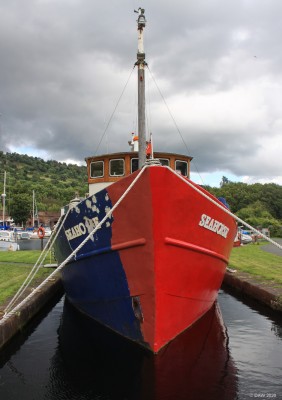 A boat of two halves, Bowling
Taken at the Bowling Basin at the start, or end of the Forth & Clyde Canal, depending on your point of view.  [url=http://streetmap.co.uk/map.srf?X=244988&Y=673487&A=Y&Z=115/] Map location. [/url]
