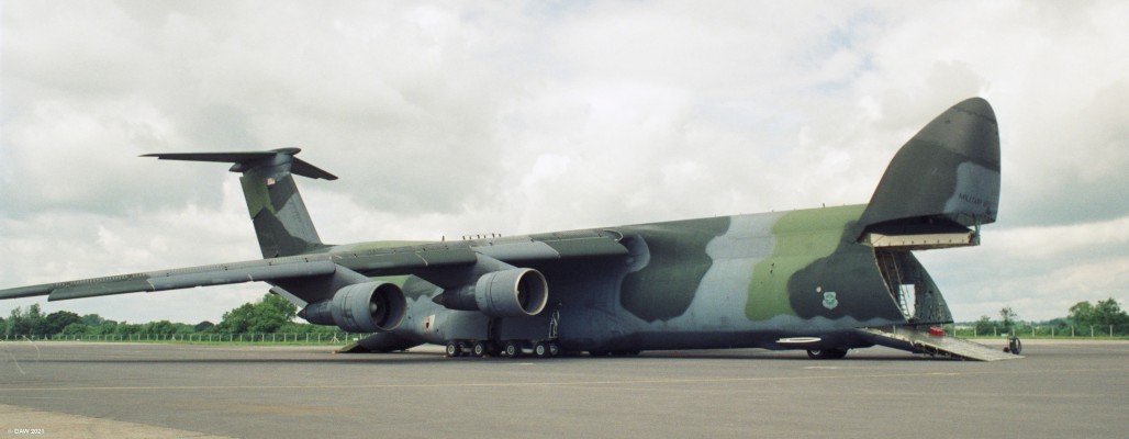Lockheed C5 Galaxy, Fairford, 1993
The C5 transport aircraft looking a bit like a giant basking shark with its front and rear doors opened fully.
