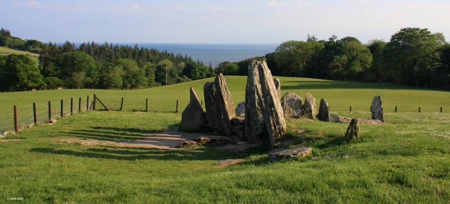 Cairnholy I, chambered Tomb
The evening sun casts shadows at Cairnholy Chambered Tomb on the gently sloping hills above Kirkdale Glen.  The tomb dates from between 4,000 and 6000 years ago.  The curving facade of standing stones  form a backcloth to a forecourt in front of the tomb and it is tempting to this tomb as a focus for ceremonies. 
