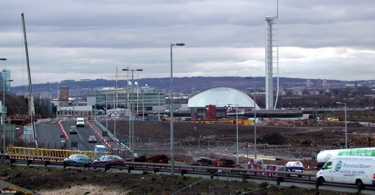 Looking up river from Partick Railway Station
Taken in 2007 when the Clydeside express was being re-aligned to make way for the new transport Museum and other developments.  The masts of the Glen Lee tall ship can be seen with the new BBC headquarters behind, to the right is the science centre and tower.  [url=http://www.streetmap.co.uk/map.srf?X=255646&Y=666440&A=Y&Z=115/] Map location. [/url]
