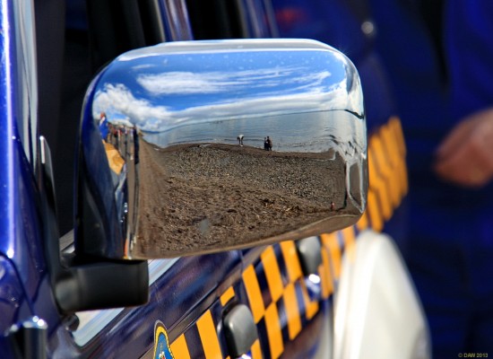 Coastguard
The ayrshire coast reflected on the wing mirror of a coastguard vehicle at the Largs Viking festival, 2011.
