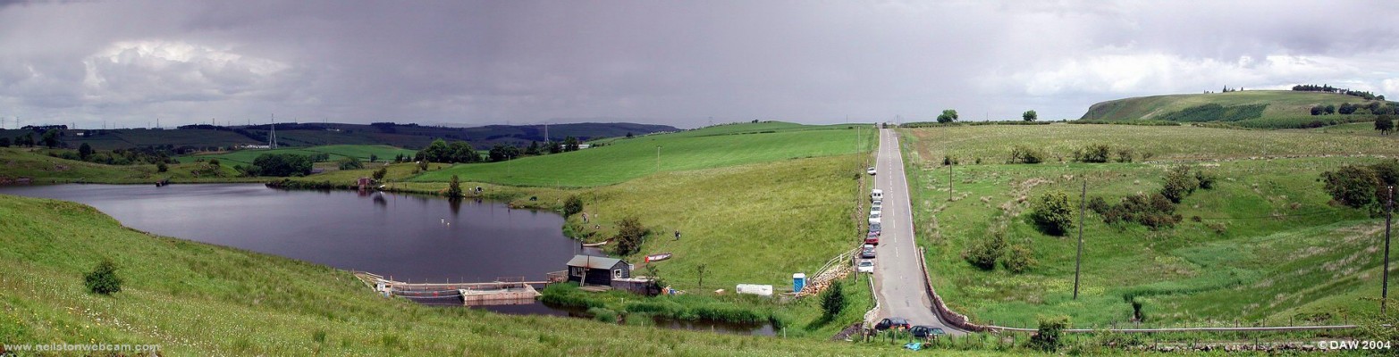 The Commore Dam and Neilston Pad
The road in the centre of the picture is the old 'switchback' from Neilston to Kimlarnock.  Driving along this road in a car is about as close as you can get to a roller coaster.  Even by 1820 it was realised it wasn't good enough and the new 'turnpike' was built along the Levern valley to Irvine, Ayr and Kilmarnock at the amazing cost of ?18,000.
