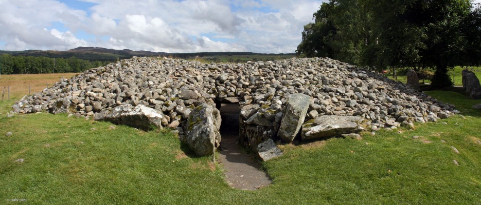 Corrimony Chambered Cairn
Corrimoney is one of the best preserved chambered Cairns you will find, the passageway roof is till intact although the chamber in the centre is open.  It is very similar to the "Clava" cairns with its passageway facing south west.  It is thought to date from 2,000 BC.  [url=https://streetmap.co.uk/map.srf?X=238278&Y=830295&A=Y&Z=115/] Map location. [/url]
