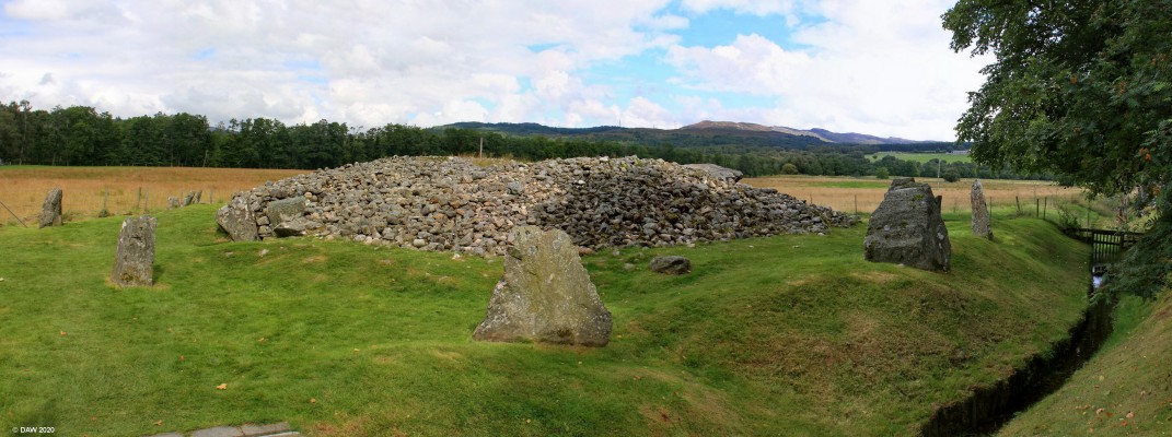 Corrimony Chambered Cairn
The 4,000 year old burial chamber at Corrimony.  Today the chamber is opened to the elements but when built it would have been completely enclosed and therefore would have been higher.  The large stone you see on top of the stones to the right is thought to have been the cap stone. [url=https://streetmap.co.uk/map.srf?X=238251&Y=830294&A=Y&Z=120/] Map location. [/url]
