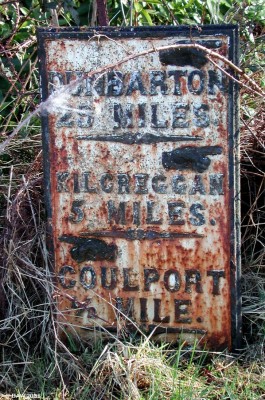 The lost village of Coulport
The MoD owns vast areas of land in the UK.  This old mile marker points to the village of coulport, however,  within a few hundred metres of this point is a security gate with armed gaurds at the entrance to RNAD Coulport.  The village is gone and a large area of land around is now one of the most sensitive security areas in the UK with bunkers for storage of the RN's Trident D5 Missiles. [url=www.multimap.com/map/browse.cgi?lat=56.0414&lon=-4.8701&scale=25000&icon=x] Map location.[/url]
