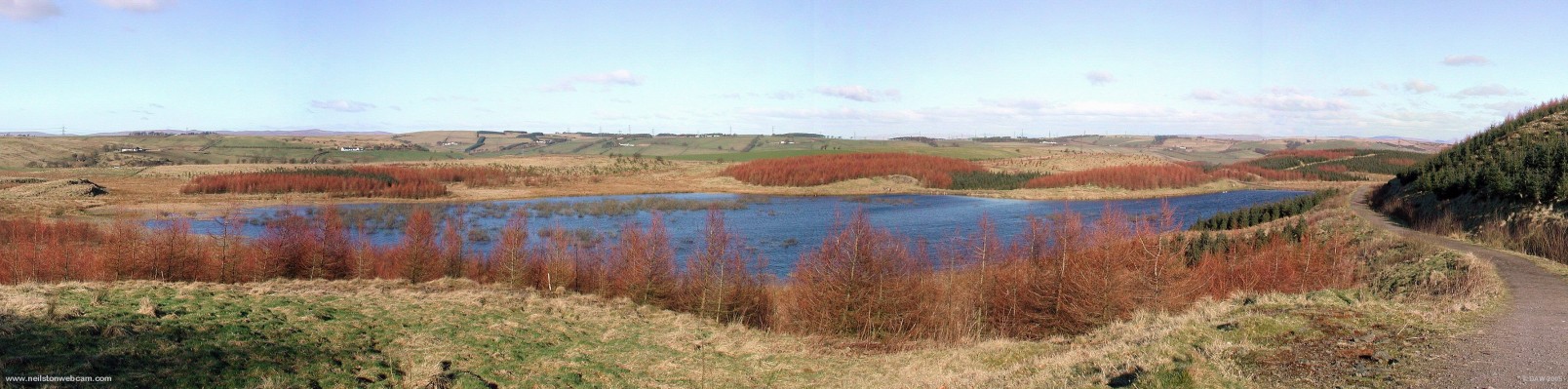 Panoramic view over Craighall Dam
This view was taken in early 2004 and shows the winter colours of the East Renfrewshire Community Woodland planted around the loch and area around the Neilston Pad. [url=http://www.multimap.com/map/browse.cgi?lat=55.7645&lon=-4.4356&scale=25000&icon=x]Map location[/url]
