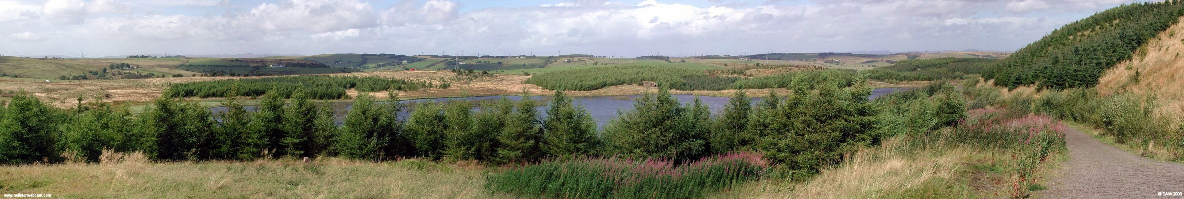 East Renfrewshire Community Woodland
Better known as the Neilston Pad, this summer view is over looking Craighall Dam.  It was taken in 2005 and shows how the conifers are slowly but surely changing the landscape.  [url=http://www.streetmap.co.uk/streetmap.dll?G2M?X=247260&Y=654910&A=Y&Z=120/]Map location.[/url]
