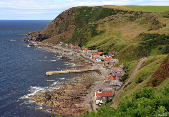 Crovie, Aberdeenshire
The small fishing village of Crovie seems to be just clinging on the shore.  It was established after the highland clearances by crofter who had been moved off the land to make way for sheep.  There is only a foot path along the front of the house and no access for vehicles. [url=http://streetmap.co.uk/map.srf?X=380650&Y=865205&A=Y&Z=120/] Map location. [/url]
