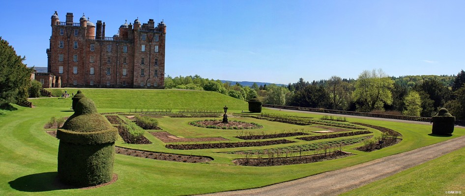 Drumlanrig Castle, side view
A side view of Drumlanrig Castle, constructed in the 17th century from distinctive pink sandstone by first Duke of Queensberry, William Douglas on the site of an ancient Douglas stronghold.  This photo was taken early in the season while the flower beds are still being worked on for the summer.
