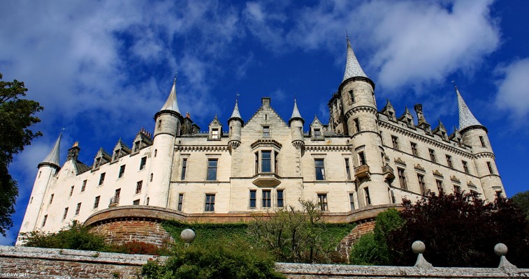 Dunrobin Castle
Dunrobin Castle from the gardens below looking like a fairy tale castle with its pointed turrets and light coloured stone. [url=http://www.streetmap.co.uk/map.srf?X=285111&Y=900774&A=Y&Z=115/] Map location. [/url]
