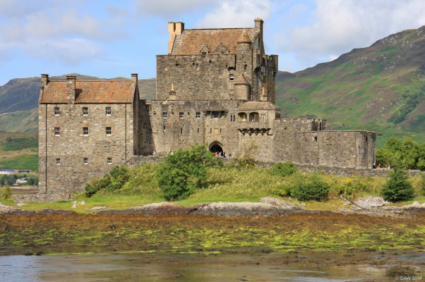 Eilean Donan Castle
A view of Eilean Donan Castle with the tide out.   The Castle sits on a small island on Loch Duich, what you see today is a romantic reconstruction dating from the early 20th century, but its still worth a visit.  [url=http://streetmap.co.uk/map.srf?X=188303&Y=825837&A=Y&Z=115/] Map location. [/url]
