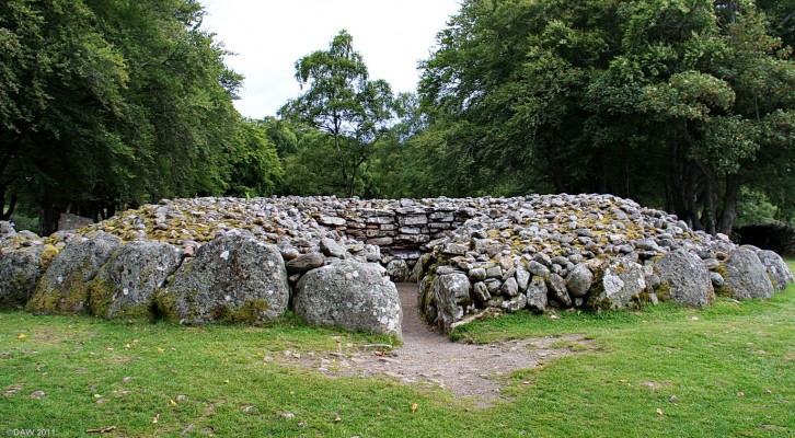 Entrance to the South West Passage Grave at Clava
What you see here today is very different from how it was built in the Bronze Age.  The entire structure would have been covered.  There would have been large flag stones covering the entrance passage such that you would have to crawl to enter.  The grave was excavated in 1828 but little is known of the human remains that were found. [url=http://www.streetmap.co.uk/map.srf?X=275681&Y=844360&A=Y&Z=115/] Map location. [/url]
