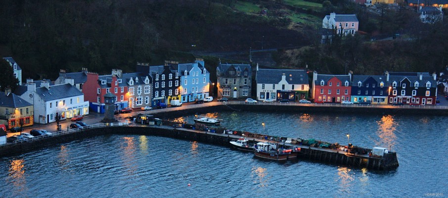 Dusk view over Tobermory
Tobermory is the largest settlement on Mull with a population of around 700.  Like so many west coast towns it was developed as a fishery port by the British Fisheries Society due to its natural harbour.  Today it is better known for the childrens tv programme, Balamory.  [url=http://www.streetmap.co.uk/map.srf?X=150467&Y=754932&A=Y&Z=115/] Map location. [/url]
