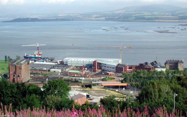 Ferguson Ailsa Shipyard, Port Glasgow
The lower Clyde's last remaining shipyard.  The ship moored is the Cefas Endeavour which was launched on August 2002 about a month before this photo was taken.  Newark Castle is to the right of the yard.  This view also shows how narrow the navigation channel is on the Clyde here despite its apparent width as noted by all the sand banks on the far side. [url=http://www.multimap.com/map/browse.cgi?lat=55.9303&lon=-4.6803&scale=10000&icon=x/]Map location[/url]
