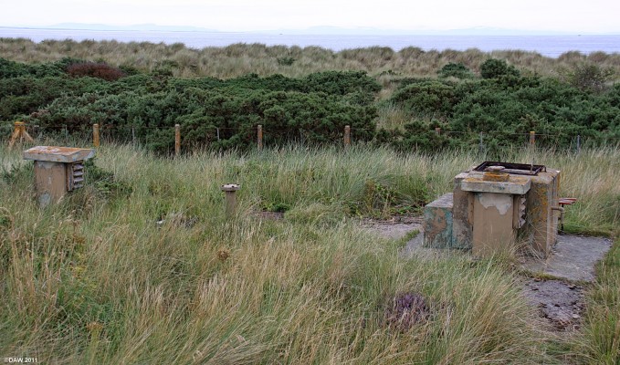 Findhorn ROC Post
Right on the dunes near the car park with views out to sea towards Sutherland.  Taken in August 2009 at which time the hatch was broken off and the inside looked water logged. [url=http://www.streetmap.co.uk/map.srf?X=303539&Y=864860&A=Y&Z=115/] Map location. [/url]
