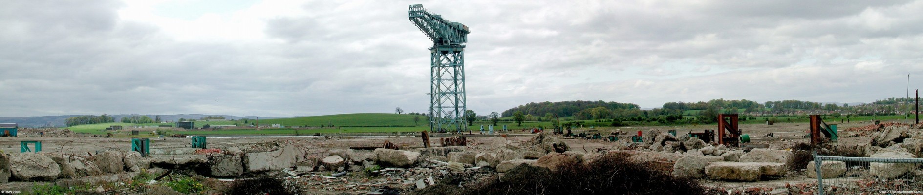 Splendid desolation, John Brown's shipyard, 2004
This massive Titan Crane is all that remains of John Brown's shipyard at Clydebank.  At its peak the yard employed thousands and was the birthplace of the first three "Queens" of the Cunard line.  The site is currently being redeveloped at a cost of ?350m with a mix of housing, retail, business and leisure facilities.
