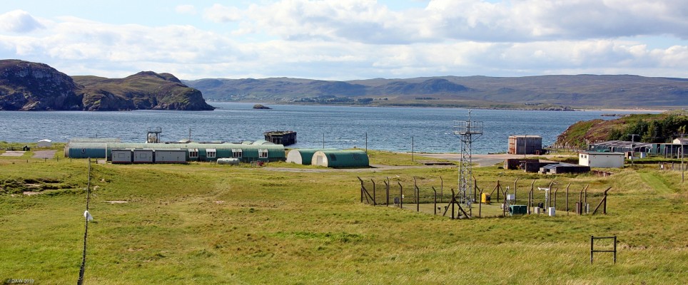 Boom defence Depot, Mellon Charles
The former Boom defence site at Mellon Charles, Loch Ewe.  Submarine nets were places across the mouth of Loch Ewe at this point to protect the gathering Russian Convoys that used the Loch as a safe haven.  The site was apparently still in use until recently.  The fenced area is an automated weather station operation by the MET Office. [url=http://www.streetmap.co.uk/map.srf?X=184832&Y=891382&A=Y&Z=115/] Map location. [/url]

