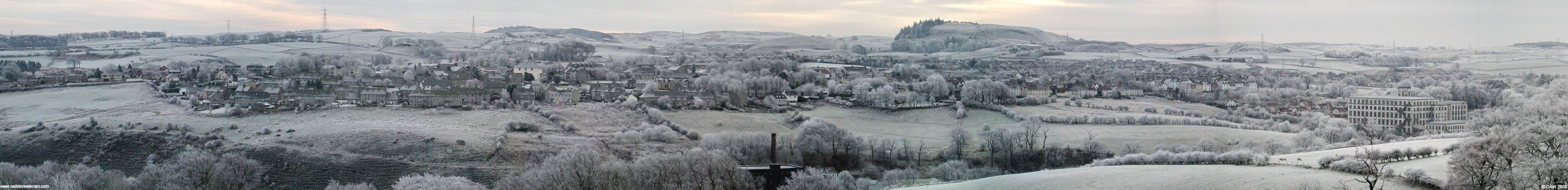 Frozen Neilston, December 2005
Taken from the top of the Killoch Glen footpath.  On the extreme right is Crofthead Mill, in the lower centre is the former Broadlie Mill and right of centre on the horizon is the Neilston Pad.  The white building of the Neilston Parish Church can be seen left of centre.
