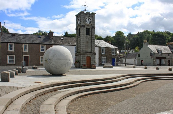 The town clock, Gatehouse of Fleet
The Clock Tower and unusual sculpture in Gatehouse of Fleet, anyone who watched the 1960's tv series "The Prisoner" might find this slightly unsettling.  [url=http://streetmap.co.uk/map.srf?X=260142&Y=556476&A=Y&Z=115/] Map location. [/url]
