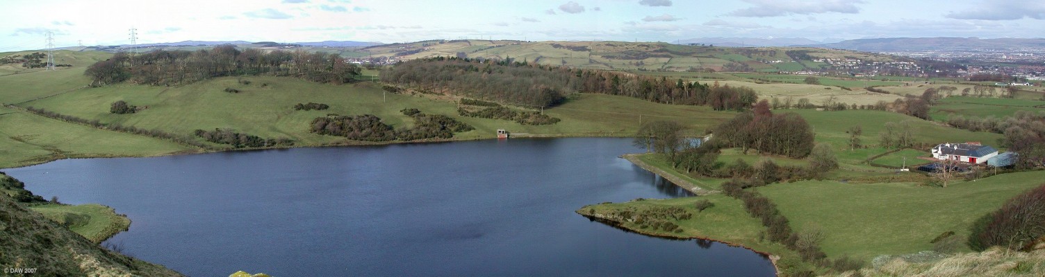 Glanderston Dam viewed from the top of the Craigie
This seems like a tranquil view even on a cold winter day but on the night of 30th December, 1842, Glanderston Dam burst its bank and flooded down the valley to the printworks it  then supplied killing eight members of one family.  Neilston can be seen in the gap in the trees near the centre.  [url=http://www.streetmap.co.uk/streetmap.dll?G2M?X=250110&Y=655970&A=Y&Z=3/]Map location[/url]
