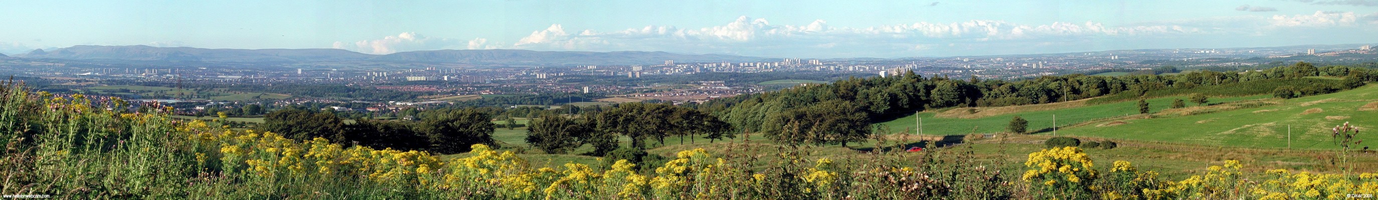 Panoramic view over Glasgow from Dyke Hill
Over looking Greater Glasgow on a very clear evening from above Barrhead, the view covers from Paisley on the left all the way round to the now demolished tower blocks on the Cathkin Braes.  The photo was taken in 2005.  [url=http://www.streetmap.co.uk/streetmap.dll?G2M?X=248895&Y=656085&A=Y&Z=120/]Map location.[/url]
