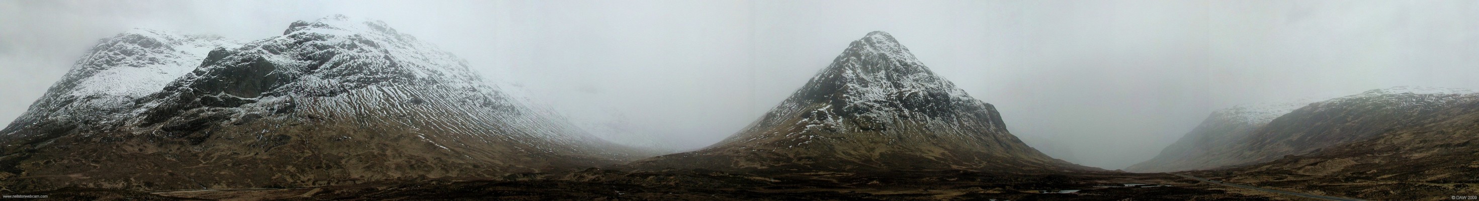 Winter view above Glen Coe
The Buachaille Etive Mor range of mountains are on the left with Stob Dearg rising to 1022m, further right in Stob Coire Raineach at 925m.  The main A82 route north can be seen on the right heading towards the Pass of Glen Coe.  [url=http://www.streetmap.co.uk/map.srf?X=221147&Y=755513&A=Y&Z=120&ax=221342&ay=755858/] Map location. [/url]
