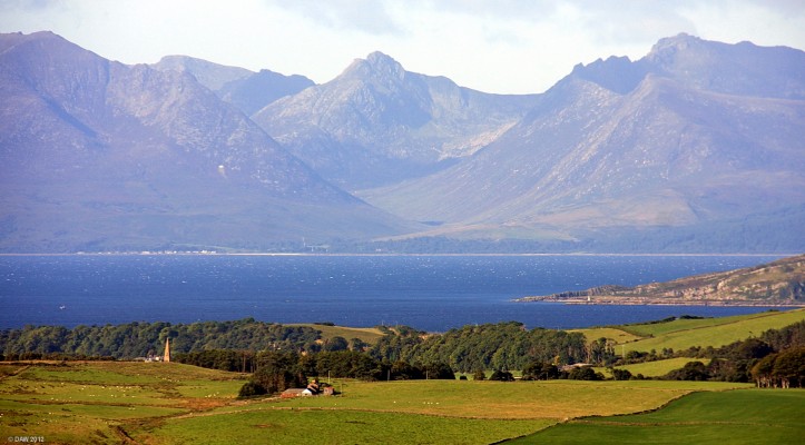 Glen Sannox, Arran
Looking over towards Arran from above Largs on a particularly clear morning.  The land in the foreground is the Great Cumbrae, you can see the steeple of Millport Cathedral.  On the right is the tail end of the Island of Bute and in the centre is Glen Sannox on Arran.  The village of Sannox is probably what you see on the shore.  [url=http://www.streetmap.co.uk/map.srf?X=221411&Y=658516&A=Y&Z=120/] Map location. [/url]
