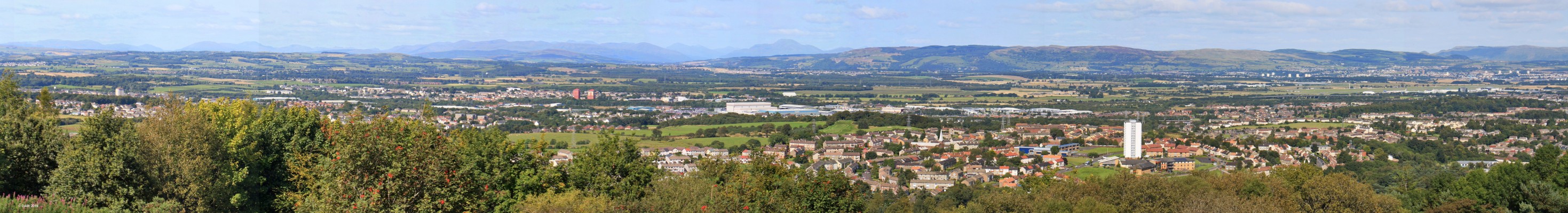 Glenifer Braes Panorama, 2015
Panaormaic view from the Glenifer braes above Paisley taken in 2015.  In the centre in the distance is Ben Lomond. Towards the left is Linwood and Johnstone and the Foxbar area of Paisley is closest with the Airport in the distance on the right. [url=http://streetmap.co.uk/map.srf?X=245741&Y=660646&A=Y&Z=120/] Map location. [/url]
