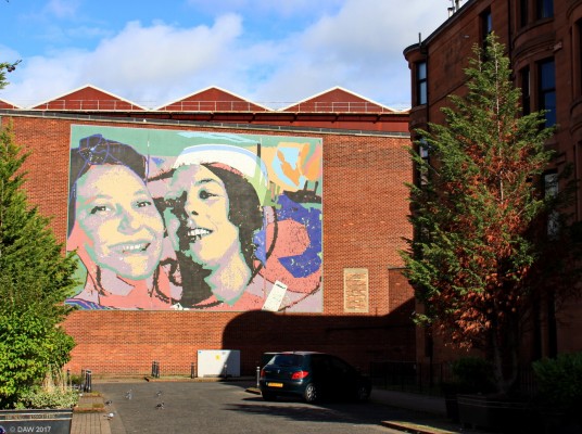 Govan Women mural, Govan
A collaboration between Govan Housing Association and the artist Nicholas Martin to brighten up the walls of Govan shipyard.  Its only when you get close up you realise its not painted but is in fact a mosaic made of 1" squares.
