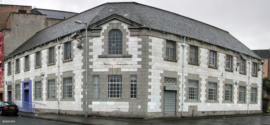 The old Employment Exchange, Govan
Before the days of Job Seekers Plus you went to the Ministry of Labour Employment exchange to look for a job.  This building dates from 1931 and was used as the 'buroo' office up until about 1980.  It was apparently the last employment exchange to be heated by a coal fired boiler.  The small grey rectangle to the right of the shuttered door is probably where the coal was loaded into the building.  The foreboding gate with with spikes on the right hand extreme was the 'claimants entrance'.  
