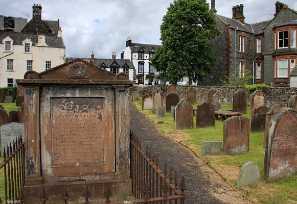 Grave of James McGeorge, Mail Guard, Moffat Cemetery
Every head stone tells a tale, on the morning of 1st Feb 1831 James McGeorge and his driver, John Goodfellow, headed from Dumfries to Edinburgh on the horse drawn mail coach during a snow storm.  A few miles from Moffat the going became too difficult, two male passengers took two horses back to Moffat to get help whilst females sheltered in the coach. James and John decided to continue with the mail on horse.  Both men succumbed to the weather only a few miles further along the road.
