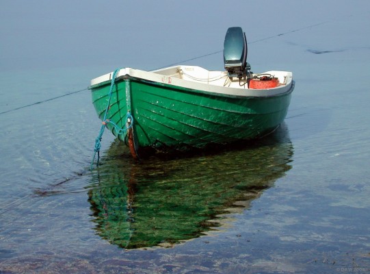 Boat moored in calm waters of Applecross
