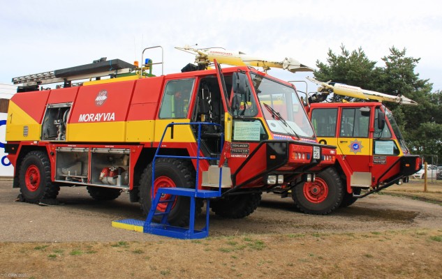 Highland Protector Airport Fire Engine, Morayvia, Kinloss
Designed in 1991 by Simon Gloster Saro as a Rapid Intervention Vehicle it can carry up to 6000 litres of water.  It was ordered for eight airports of the Highland and Islands Airports Authority.  The one in the foreground was used at Benbecula Airport from 1994 to 2014.

