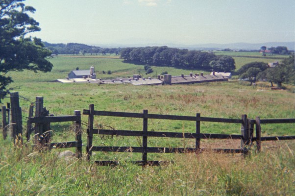 Howie of Dunlop Grain Store, 1976
The buildings you can see in the foreground were the Grain Store for Howie of Dunlop, they have now been demolished.  In the distance you can just about get a hazy view of Arran. [url=http://streetmap.co.uk/map.srf?X=243747&Y=650220&A=Y&Z=115/] Map location. [/url]
