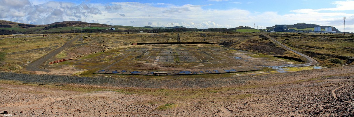 Hunterston Construction yard
Looking into the dry dock at Hunterston.  The top of the bank is made of sand and can be removed to allow structures to float in or out.  On the right is Hunterston A and B power station, the A station (white building) is now in the decommission phase.
