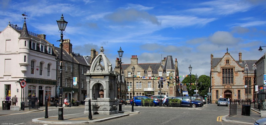 Huntly Town square
There has been settlement here since the 12th century but the town you see today mainly dates from 1769 when the Duke of Gordon established a planned town.  This is also when the name Huntly came in to use, previously it had been known as Milton of Strahbogie.  [url=http://www.streetmap.co.uk/map.srf?X=352896&Y=839945&A=Y&Z=115/] Map location. [/url]
