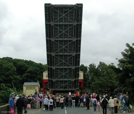 The Inchinnan Bridge
The Inchinnan Bridge salutes the crowd.  Built in 1923 by Sir William Arrol & Co Ltd to take the road over the Black cart river but still allow boats to get up to Paisley.  It is the only operational example of a Scherger type Bascule bridge in Scotland.  The Grade A listed structure was refurbished and strengthed in 2004 at a cost of over �1 million. [url=http://www.streetmap.co.uk/idmap.srf?X=249220&Y=668005&A=Y&Z=120/] Map location. [/url]

