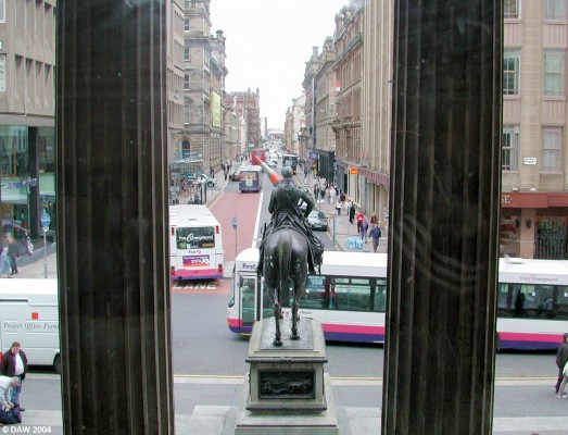 Ingram Street
Ingram Street viewed from inside the Gallery of Modern Art, The Duke of Wellington Statue is in full ceremonial dress with obligatory traffic cone.
