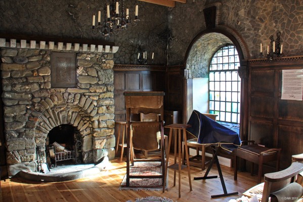 Inside Kirkandrews Kirk
Inside the rather quirky [url=http://kirkandrewskirk.wordpress.com/] Kirkandrews Kirk. [/url]  Its more like a living room with its large open fireplace.  There's a greenish light comes through the marbled glass windows.
